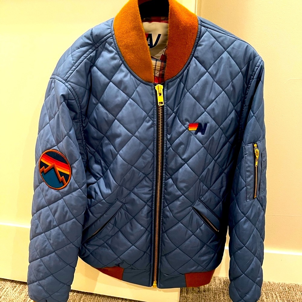 Aviator Nation Quilted and insulated Blue Bomber Jacket with mountain patch.